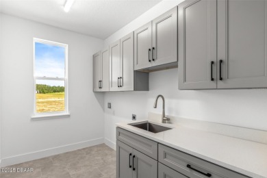 Welcome to 'The Lydia', a luxurious 2-story home in the on LPGA International Golf Course in Florida - for sale on GolfHomes.com, golf home, golf lot