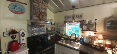 Lovely Cottage style living with 2 bedrooms, 2.5 baths! You must on Lake Tansi Village Country Club in Tennessee - for sale on GolfHomes.com, golf home, golf lot