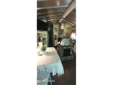 Lovely Cottage style living with 2 bedrooms, 2.5 baths! You must on Lake Tansi Village Country Club in Tennessee - for sale on GolfHomes.com, golf home, golf lot