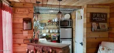 Lovely Cottage style living with 2 bedrooms, 2.5 baths! You must on Lake Tansi Village Country Club in Tennessee - for sale on GolfHomes.com, golf home, golf lot
