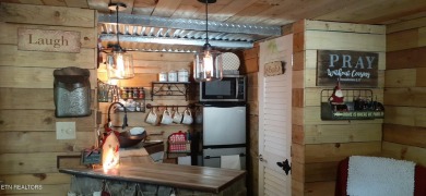 Lovely Cottage style living with 2 bedrooms, 2.5 baths! You must on Lake Tansi Village Country Club in Tennessee - for sale on GolfHomes.com, golf home, golf lot