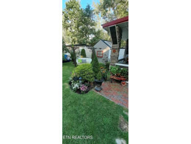 Lovely Cottage style living with 2 bedrooms, 2.5 baths! You must on Lake Tansi Village Country Club in Tennessee - for sale on GolfHomes.com, golf home, golf lot