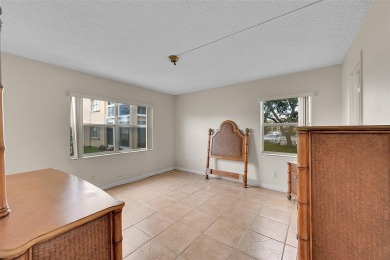 1st Floor, all tile, ground floor, corner unit. Great water on Sunrise Lakes Phase III in Florida - for sale on GolfHomes.com, golf home, golf lot