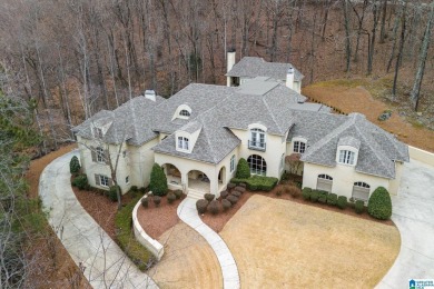 This grand Greystone home is nestled within its wooded  private on Greystone Golf and Country Club-Founders Course in Alabama - for sale on GolfHomes.com, golf home, golf lot