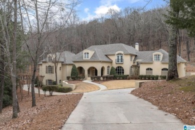 This grand Greystone home is nestled within its wooded  private on Greystone Golf and Country Club-Founders Course in Alabama - for sale on GolfHomes.com, golf home, golf lot