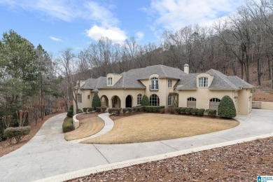 This grand Greystone home is nestled within its wooded  private on Greystone Golf and Country Club-Founders Course in Alabama - for sale on GolfHomes.com, golf home, golf lot