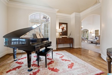 This grand Greystone home is nestled within its wooded  private on Greystone Golf and Country Club-Founders Course in Alabama - for sale on GolfHomes.com, golf home, golf lot