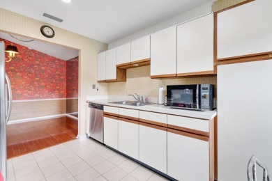Discover the perfect blend of comfort and convenience within the on PGA National Golf Club in Florida - for sale on GolfHomes.com, golf home, golf lot