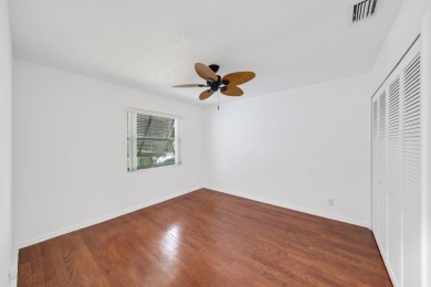 Discover the perfect blend of comfort and convenience within the on PGA National Golf Club in Florida - for sale on GolfHomes.com, golf home, golf lot