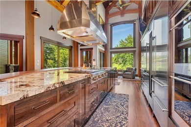 Enjoy the epitome of luxury living on the 16th & 17th hole at on St. Cloud Country Club in Minnesota - for sale on GolfHomes.com, golf home, golf lot