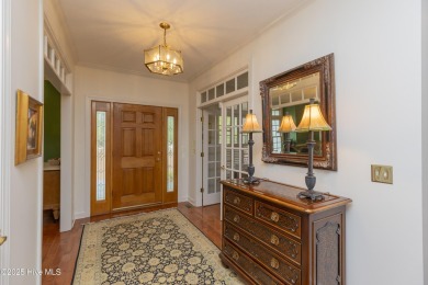 Situated in a peaceful cul-de-sac, this home sits on a large 2 on Pinewild Country Club of Pinehurst in North Carolina - for sale on GolfHomes.com, golf home, golf lot