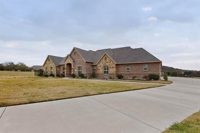 Experience elevated living in Cedar Hill's prestigious Lake on Tangle Ridge Golf Club in Texas - for sale on GolfHomes.com, golf home, golf lot