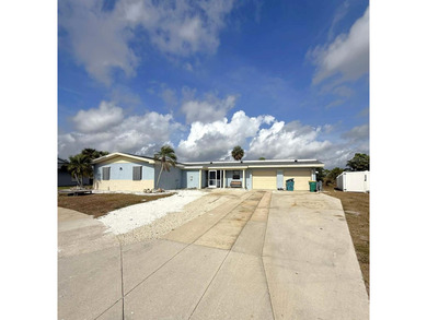 Short Sale. This LARGE 3/2/2 pool home sits on a peaceful on Port Charlotte Golf Club in Florida - for sale on GolfHomes.com, golf home, golf lot