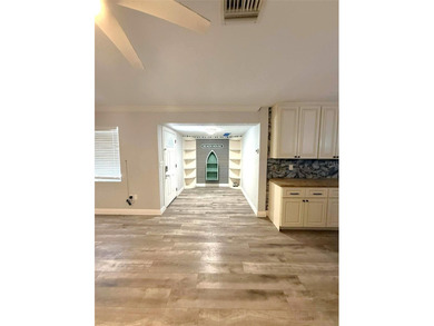 Short Sale. This LARGE 4/2/2 pool home sits on a peaceful on Port Charlotte Golf Club in Florida - for sale on GolfHomes.com, golf home, golf lot