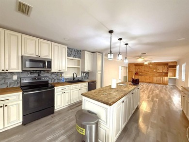 Short Sale. This LARGE 4/2/2 pool home sits on a peaceful on Port Charlotte Golf Club in Florida - for sale on GolfHomes.com, golf home, golf lot