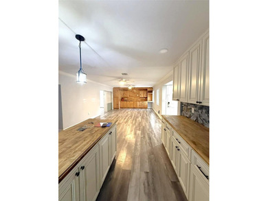 Short Sale. This LARGE 4/2/2 pool home sits on a peaceful on Port Charlotte Golf Club in Florida - for sale on GolfHomes.com, golf home, golf lot