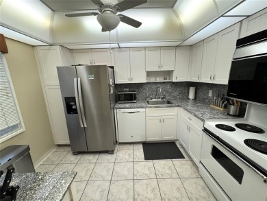 Beautifully updated 2BR/2BA condo in lush Palm Aire with on Palm-Aire Country Club and Resort - The Oaks in Florida - for sale on GolfHomes.com, golf home, golf lot