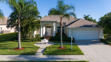 Overlooking the 10th green in the highly desired Viera East Golf on Viera East Golf Club in Florida - for sale on GolfHomes.com, golf home, golf lot