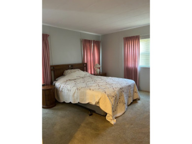 THIS TWO BEDROOM TWO BATH HOME WITH ADDITIONAL THIRD on Silver Dollar Golf and Trap Club in Florida - for sale on GolfHomes.com, golf home, golf lot