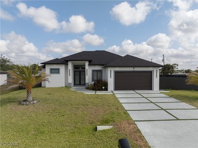 Discover refined Florida living in this exquisite 2024-built on Palmetto-Pine Country Club in Florida - for sale on GolfHomes.com, golf home, golf lot