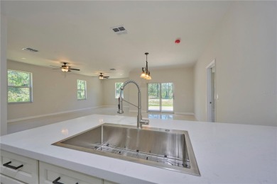 Come see the *Bella,* a gorgeous new construction home nestled on Indian Lake Estates Golf and Country Club in Florida - for sale on GolfHomes.com, golf home, golf lot