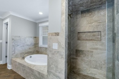 Welcome to Hampton Creek! This cozy Energy Right home is built on The Champions Club At Hampton Creek in Tennessee - for sale on GolfHomes.com, golf home, golf lot