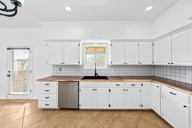 Nestled among mature trees in the Oaks of Riverhill, this on Riverhill Country Club in Texas - for sale on GolfHomes.com, golf home, golf lot