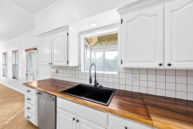 Nestled among mature trees in the Oaks of Riverhill, this on Riverhill Country Club in Texas - for sale on GolfHomes.com, golf home, golf lot