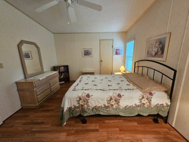 This home is located on leased land in a 55+ resort-style MH on Big Cypress Golf and Country Club in Florida - for sale on GolfHomes.com, golf home, golf lot
