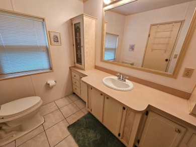 This home is located on leased land in a 55+ resort-style MH on Big Cypress Golf and Country Club in Florida - for sale on GolfHomes.com, golf home, golf lot