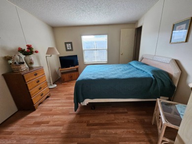 This home is located on leased land in a 55+ resort-style MH on Big Cypress Golf and Country Club in Florida - for sale on GolfHomes.com, golf home, golf lot