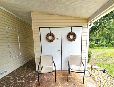This home is located on leased land in a 55+ resort-style MH on Big Cypress Golf and Country Club in Florida - for sale on GolfHomes.com, golf home, golf lot