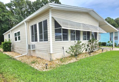 This home is located on leased land in a 55+ resort-style MH on Big Cypress Golf and Country Club in Florida - for sale on GolfHomes.com, golf home, golf lot