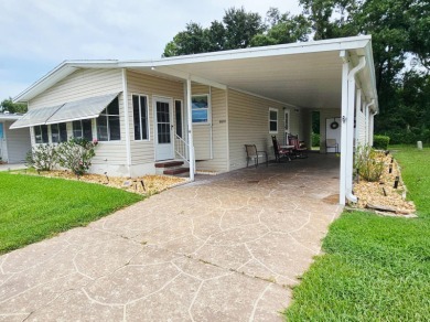 This home is located on leased land in a 55+ resort-style MH on Big Cypress Golf and Country Club in Florida - for sale on GolfHomes.com, golf home, golf lot