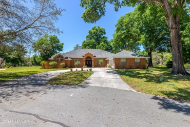 WELCOME HOME! Pull into the court and you will see this on Magnolia Point Golf and Country Club in Florida - for sale on GolfHomes.com, golf home, golf lot
