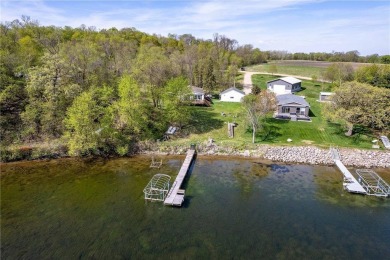 Enjoy lakeside living at its finest on beautiful Stalker Lake in on Stalker Lake Golf Course in Minnesota - for sale on GolfHomes.com, golf home, golf lot