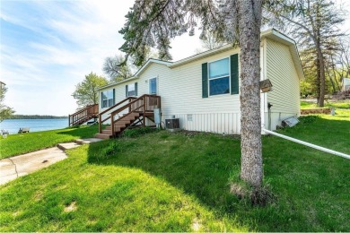 Enjoy lakeside living at its finest on beautiful Stalker Lake in on Stalker Lake Golf Course in Minnesota - for sale on GolfHomes.com, golf home, golf lot