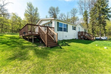 Enjoy lakeside living at its finest on beautiful Stalker Lake in on Stalker Lake Golf Course in Minnesota - for sale on GolfHomes.com, golf home, golf lot
