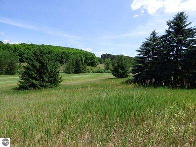 Lovely golf course lot overlooking the 6th fairway of the Summit on Shanty Creek Golf Course in Michigan - for sale on GolfHomes.com, golf home, golf lot