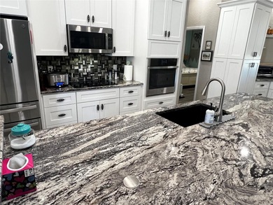 Experience the perfect blend of space, sophistication, and on Pinemoor West Golf Club in Florida - for sale on GolfHomes.com, golf home, golf lot