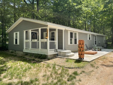Beautifully updated ranch home in Lake Isabella! This 3-bedroom on The Pines Golf Course at Lake Isabella in Michigan - for sale on GolfHomes.com, golf home, golf lot