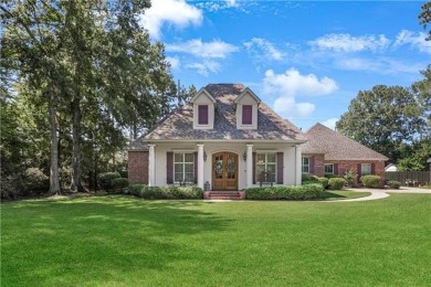 Welcome to 100 Chacahoula Lane, a classic French-style on Beau Chene Country Club in Louisiana - for sale on GolfHomes.com, golf home, golf lot