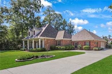Welcome to 100 Chacahoula Lane, a classic French-style on Beau Chene Country Club in Louisiana - for sale on GolfHomes.com, golf home, golf lot