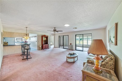 Welcome to the perfect blend of beauty and convenience in this on Falcon Watch Golf Club in Florida - for sale on GolfHomes.com, golf home, golf lot