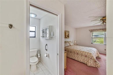 Welcome to the perfect blend of beauty and convenience in this on Falcon Watch Golf Club in Florida - for sale on GolfHomes.com, golf home, golf lot