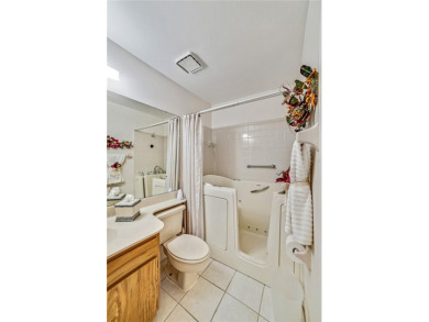 Welcome to the perfect blend of beauty and convenience in this on Falcon Watch Golf Club in Florida - for sale on GolfHomes.com, golf home, golf lot