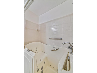 Welcome to the perfect blend of beauty and convenience in this on Falcon Watch Golf Club in Florida - for sale on GolfHomes.com, golf home, golf lot