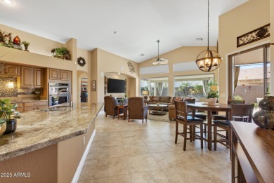 Charming home w/stone facade + extended paver front courtyard on Arizona Traditions Golf Club in Arizona - for sale on GolfHomes.com, golf home, golf lot