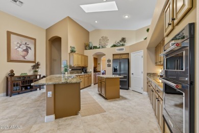 Charming home w/stone facade + extended paver front courtyard on Arizona Traditions Golf Club in Arizona - for sale on GolfHomes.com, golf home, golf lot