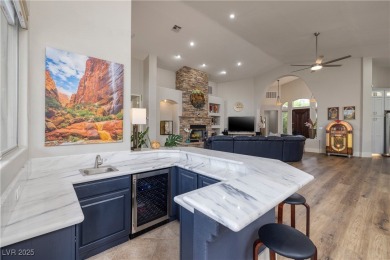 Discover refined living inside the gated Canyon Ridge community on TPC Las Vegas in Nevada - for sale on GolfHomes.com, golf home, golf lot